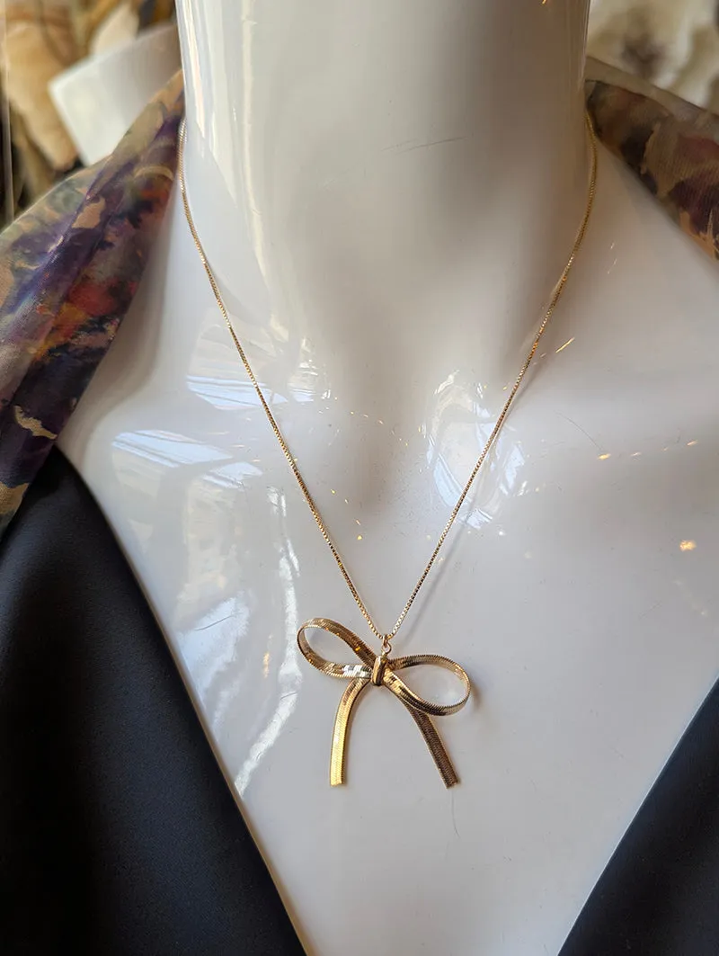 Nuance Bow Pendant Necklace